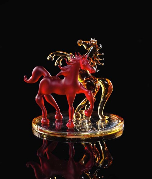 Base with two colorful blown horses