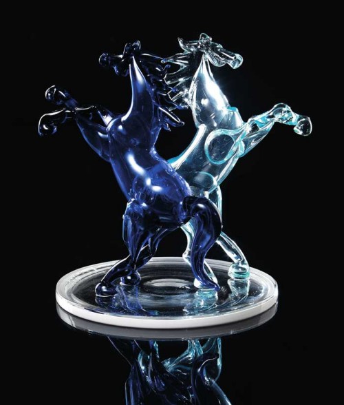 Base with two colored blown raised horses